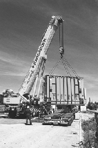 En 140 tons tung hjspndings-transformer blev mandag i sidste uge transporteret p blokvogn fra rhus til den nye transformerstation p Mellemstrupvej i strup ved Grenaa. Her er den netop blevet lftet af blokvognen